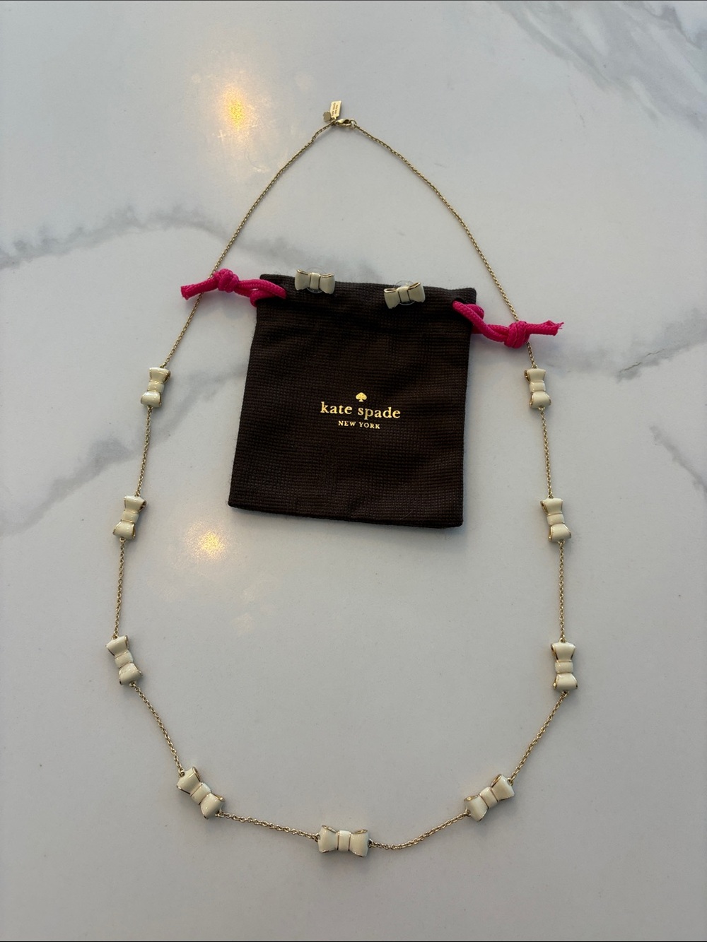 Kate Spade gold/white classic Bow Necklace with matching Bow earrings